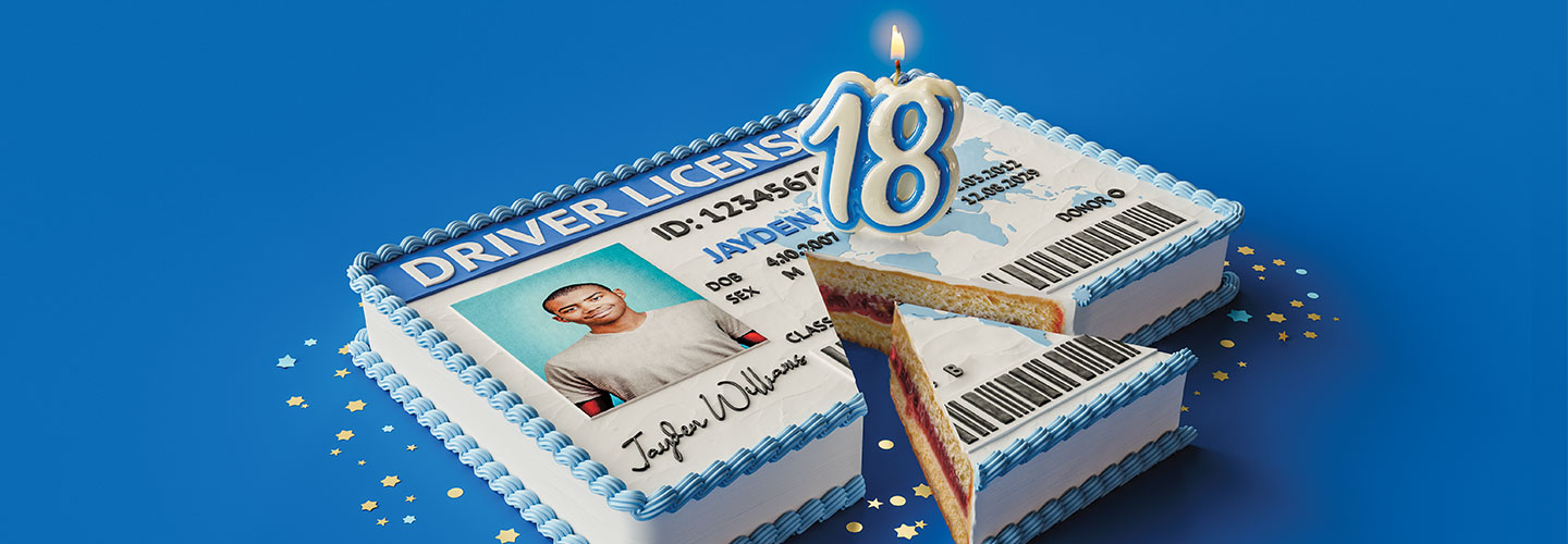 Image of a driver's licensce cake with number 18 candles on top