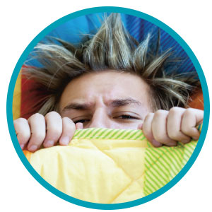 Image of a student not wanting to get out of bed